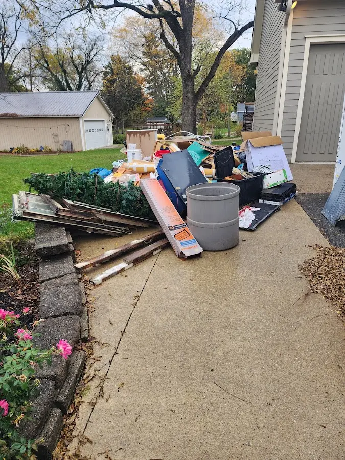 Dumpster being loaded with debris for Roofing Dumpster Rental in Florham Park